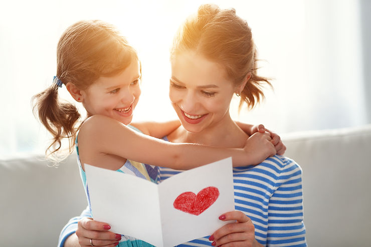 Young daughter giving her mom a card with a handdrawn heart on the front. Grieving kids will be worried about their parents. If you are parenting a bereaved child, Marble Wellness can help you navigate your grief journey. Call us today at 636-234-3052 to get started. We offer counseling for grief & loss; counseling for depression; anxiety therapy; play therapy for kids; and more. We look forward to hearing from you!