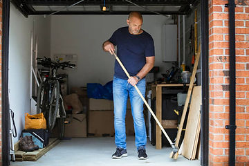 Man cleaning the garage and not listening to his wife. The man is experiencing ADHD and it is causing challenges in his marriage. Marble Wellness offers counseling for couples counseling and much more. Marble Wellness is located in St Louis and Chicago.