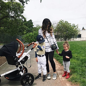 A busy mother juggling kids and a stroller while trying to get her child to baseball practice. The mother seems overwhelmed and needs help navigating her busy life. Marble Wellness offers therapy to St. Louis moms for maternal mental health, postpartum depression, anxiety and much more. Marble Wellness can help mothers to feel like themselves again. 