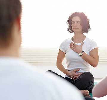 A woman using breathing exercises to help cope with chronic pain and chronic illness. Marble wellness specializes in chronic pain and chronic illness. Marble wellness is located in st. louis, mo 63011. marble wellness chronic illness therapy. 