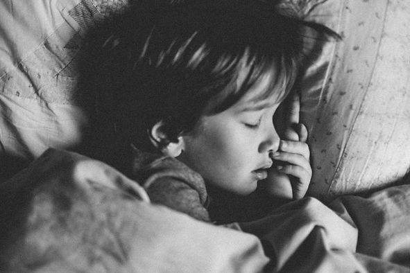 A child is sleeping peacefully at night in his bed. Marble Wellness Play Therapist can help improve a child's sleep patterns with helpful tips and tools. Marble Wellness offers Play Therapy to children ages 5 and up and is located in Ballwin 63011.