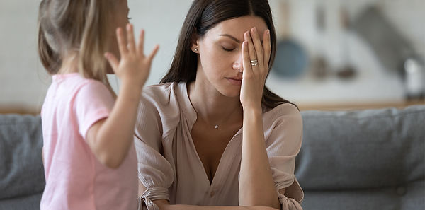 A mom looking irritable with her young daughter. Marble Wellness is counseling practice in Chicago specializing in  therapy for moms. Marble Wellness offers in person or virtual therapy.