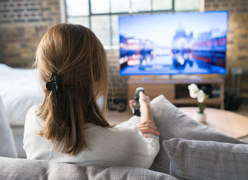 A mother watching a national tragedy on the news.  Marble Wellness can help you find ways to care for yourself after feeling consumed by  negative news. Marble Wellness specializes in anxiety, depression, stress, grief and much more!