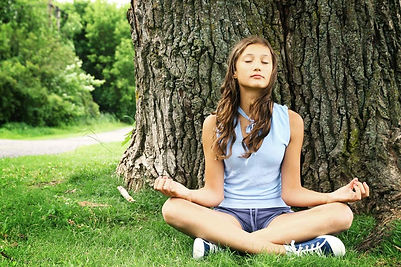A young teen using a breathing exercise to relax. Marble Wellness can help your teen cope with stress, anxiety, depression and more. 