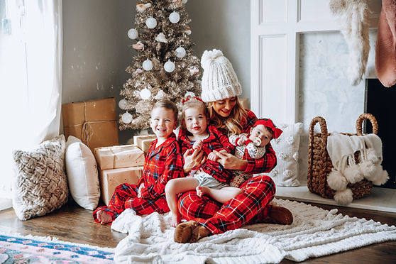 A happy mother of three enjoying the magic of the holidays. If you are stressed and dealing with maternal overwhelm, postpartum, depression or anxiety, Marble Wellness can help. Marble Wellness specializes in Maternal Mental Health. 