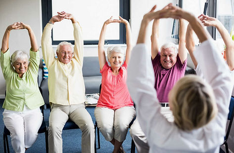 Seniors excessing and stretching at a senior center. Finding support and programs for a loved one can help you manage the stress of being a caregiver for some time. Marble Wellness is a counseling practice that specializes in helping to manage stress, anxiety, depression and more.