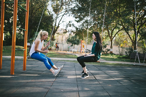 Two girls and friends talking to each other outside on a sunny nice day. Finding friends or family you can confide in will help you to open up about your challenges. Marble Wellness is a counseling practice specializing in anxiety, depression, grief, maternal mental health and much more!
