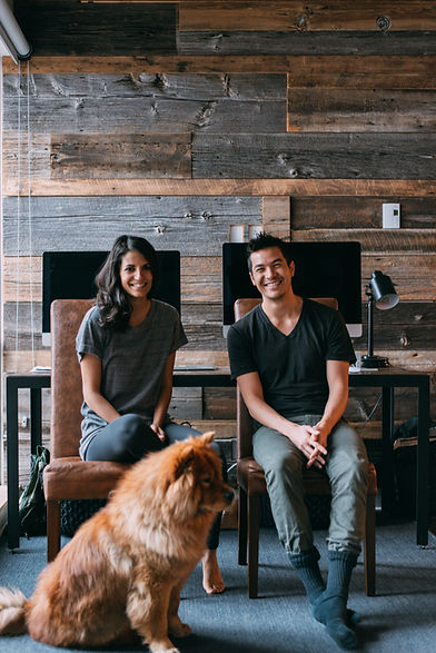 A couple and their dog sit by a table. Marble Wellness offers in-person and virtual couples counseling in Missouri.