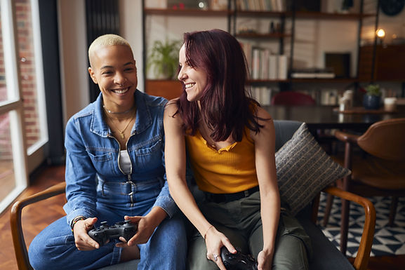 A couple plays video games together. Couples counseling is available in STL 63011 at Marble Wellness.