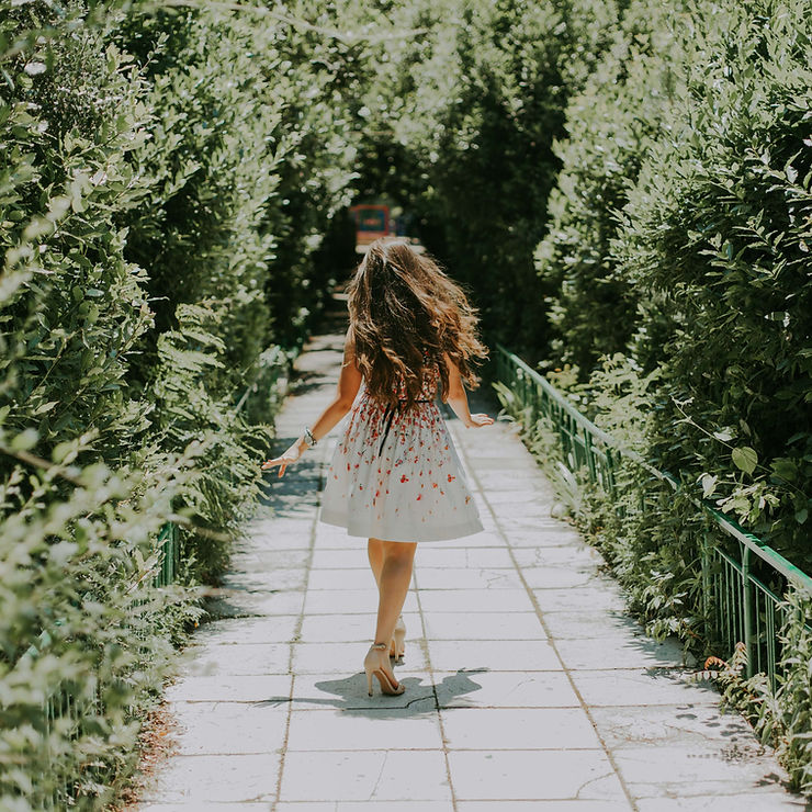 A young woman walks in a park. Therapy for Anxiety in St. Louis, MO can incorporate many different methods to address anxiety. Learn more here.