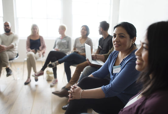 A woman attends a support group. Marble Wellness is a therapist near me in St. Louis, MO 63011 that offers in-person, virtual, and park therapy.