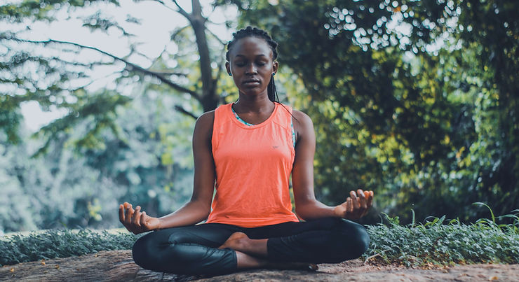 A woman practices mindfulness outside. Connect with an Anxiety Therapist and learn more about mindfulness in Therapy for Anxiety in St. Louis, MO.