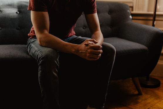 A teen boy sits on a couch during a therapy session for substance abuse therapy. Therapy for teenage boys and substance abuse therapy are available at Marble Wellness, a therapy practice in St. Louis, MO 63011.  Contact us today to start teen therapy!