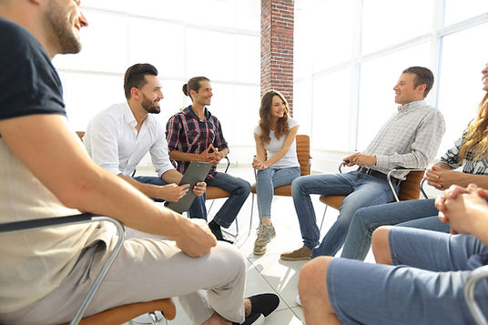 Teenagers sit in a circle at a group therapy session. Marble Wellness, a therapy practice in St. Louis, MO, offers counseling for adolescents, substance abuse therapy, teen therapy, therapy for kids, and family therapy.