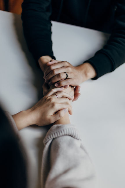 A woman holds hands with her partner for support after a miscarriage.  For emotional support after a miscarriage, therapy in St. Louis is available at Marble Wellness . Our office in west county has therapists to help with healing after a miscarriage.