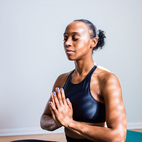 A woman practices deep breathing exercises. Therapists at Marble Wellness in Ballwin, MO 63011 teach mindfulness techniques as a form of anxiety treatment for women, men, kids, and teenagers. 