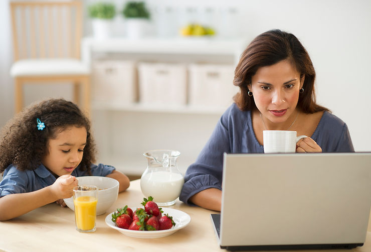 A mom sipping coffee in front of her laptop while her daughter eats breakfast at the counter next to her. Anxious moms in St. Louis, MO deserve helpful resources. We can be a place to help you find mental relief from anxiety as a mom. Call us today to get started.