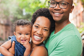 A happy couple with their baby. Communication while parenting can be difficult. Ways to boost your communication can be a great therapy topic, and counselors at Marble Wellness in St. Louis, MO are ready to help you in couples therapy.