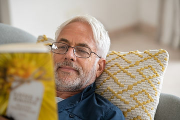 Man reading. Therapy for men in St. Louis will help you find, and make time for, your interests and leisure activities. Men's mental health is one of our specialties!