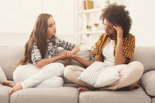 A girl helping her friend who is struggling with her mental health. Supporting a friend through tough times can be challenging and rewarding. Marble Wellness specializes in mental health and offers in person and virtual therapy. 