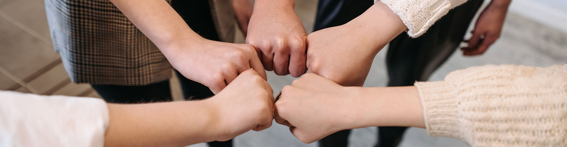 Photo of the team celebrating teamwork and connection with their hands together in a circle. At Marble Wellness, our team of dedicated therapists in St. Louis is ready to help you deal with the challenges that you are facing right now.