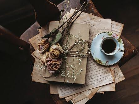 A cup of coffee on top of old letters and a notebook with dried roses. Marble Wellness offers therapy for relationships and breakups. Call to schedule an appointment today with our St. Louis clinicians.