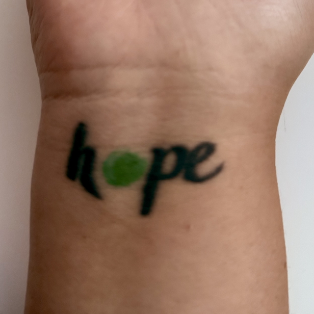 Tattoo with "Hope" written out. TTC can feel hopeless. A St. Louis area maternal mental health therapist can help!