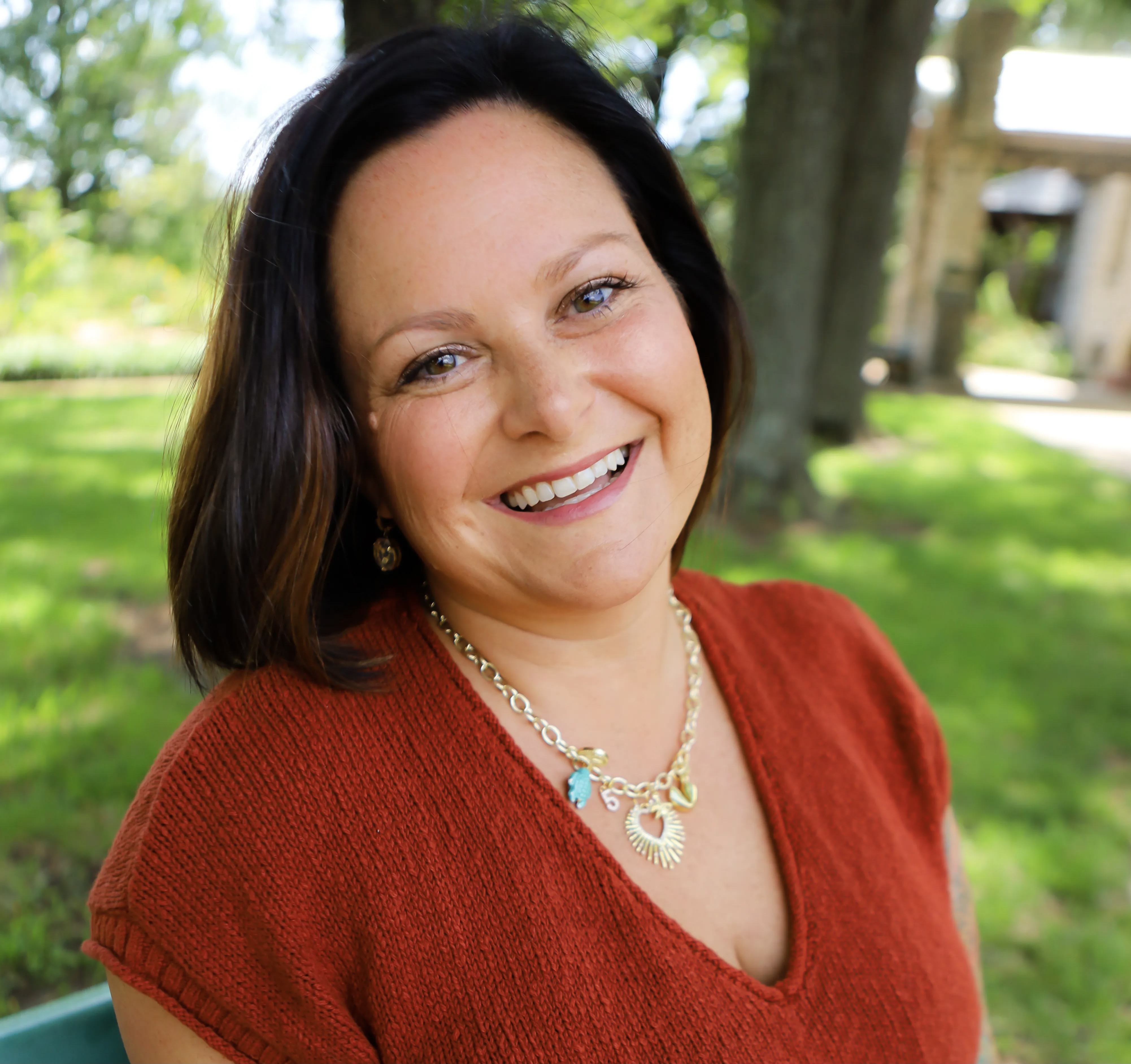 Marble Wellness therapist Marissa smiling at the camera. Meet with a Missouri online therapist for moms, dads, young adults, couples, and more here!