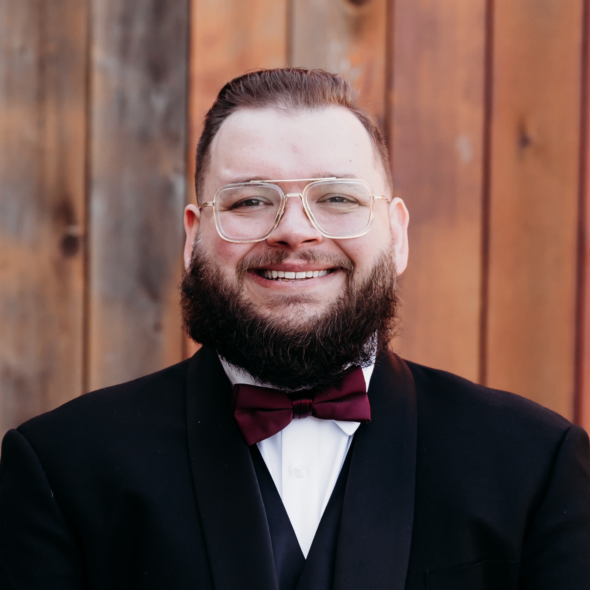 Therapist Jake Bava, looking at the camera and smiling. Jake works with teens, couples, and young adults in Ballwin, MO to feel better and find ways to thrive in life!