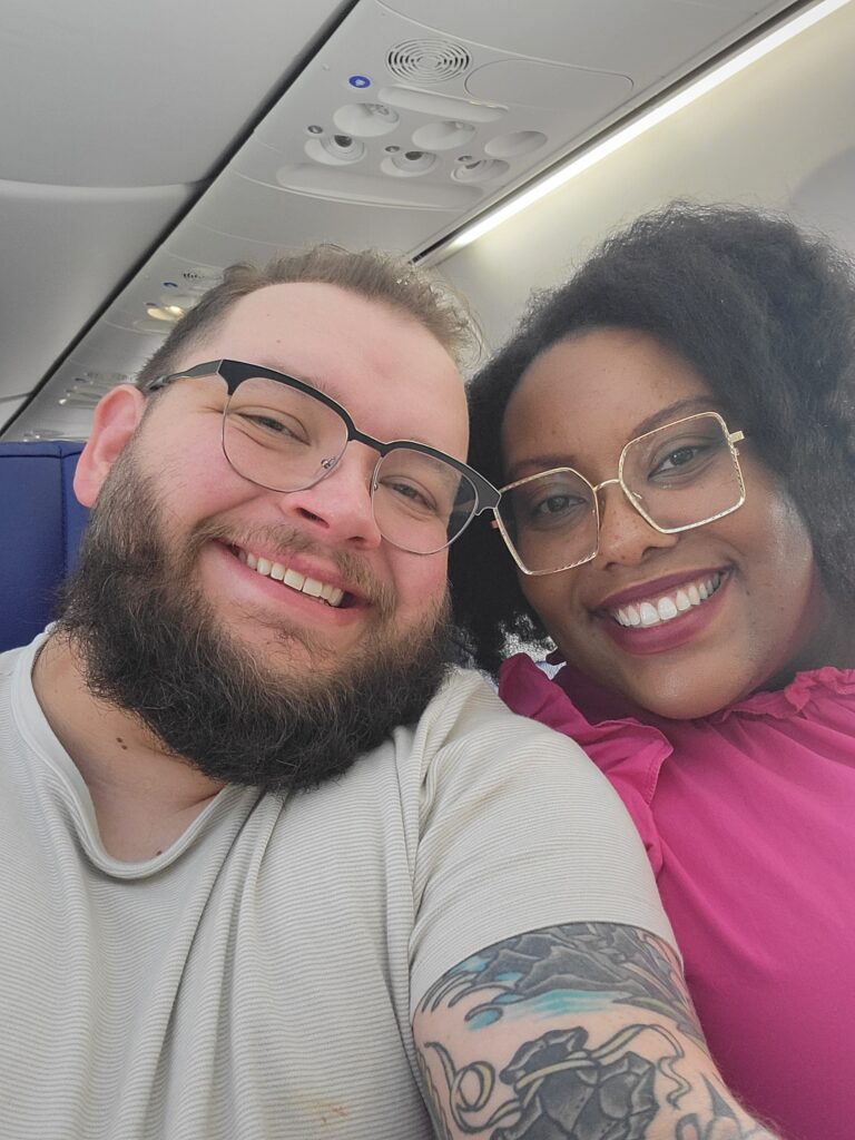 STL therapist Jake Bava and his wife on a plane for their honeymoon! Couples therapy with a Gottman trained therapist is available here.