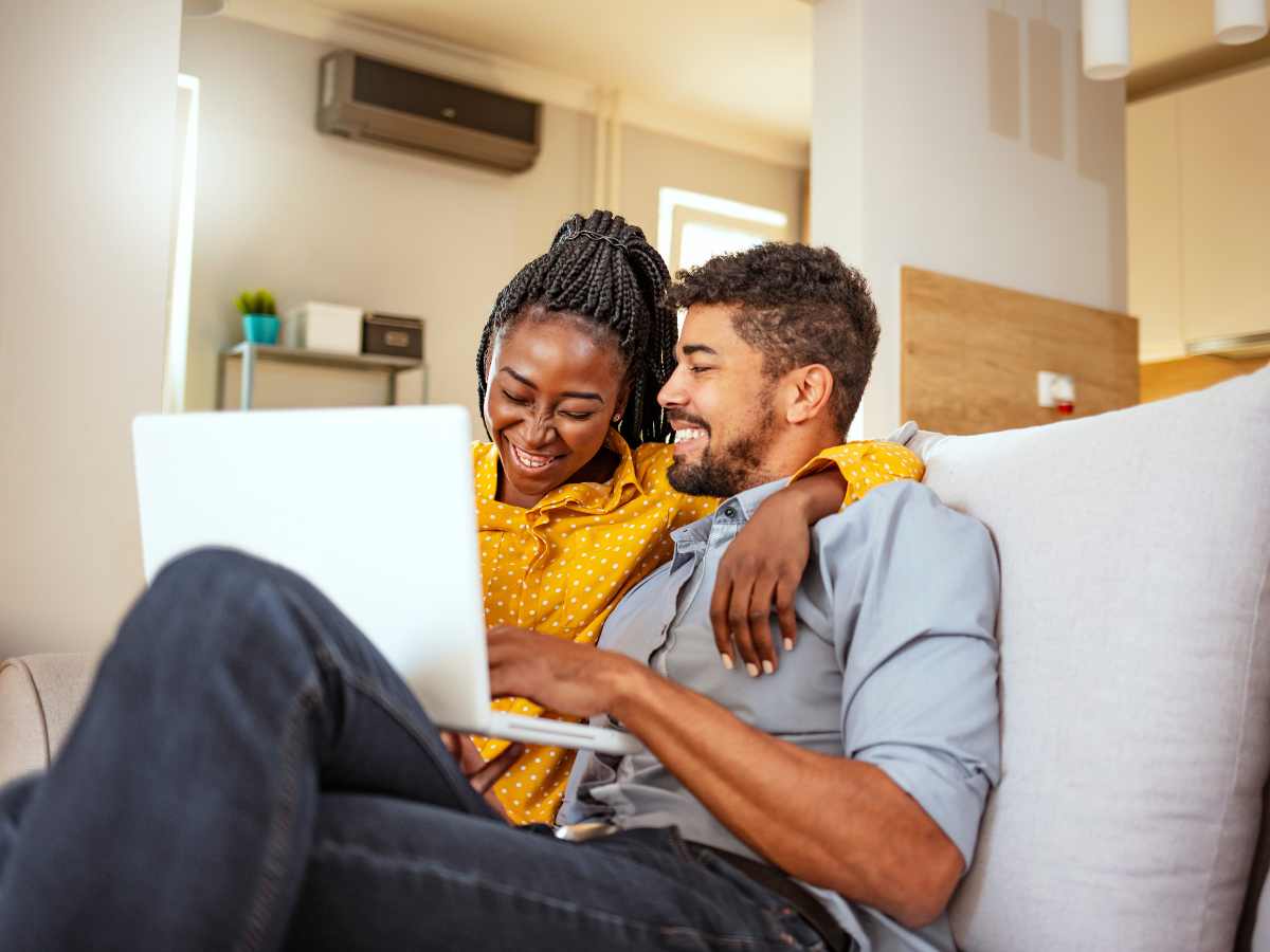 Black couple on computer playing and enjoying quality time together after a session with couples therapy in St. Louis, MO. They can become a duo again after couples and marriage therapy in St. Louis, MO. Find your flow with Marble Wellness Counseling in Kirkwood and online therapy in Missouri. We offer many services, but if you're learning to work through a difficult relationship season, try couples counseling in Kirkwood, MO.