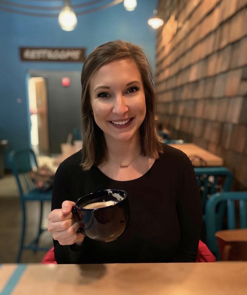 Lake St. Louis therapist Ashleigh Jones with a cup of coffee. Meet Ashleigh for young adult and college student therapy, mom therapy, and child and play therapy!